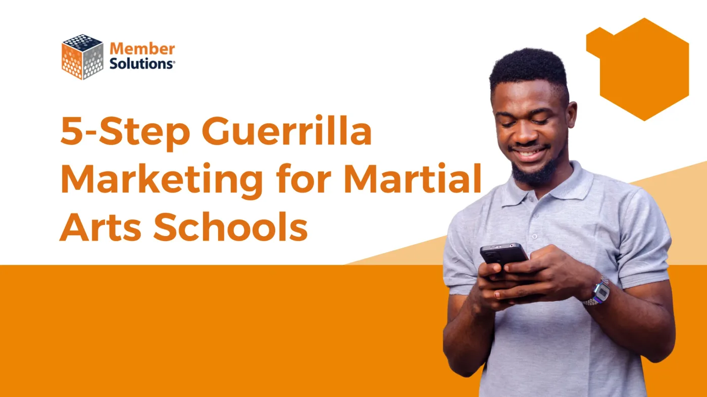 Martial arts school owner posting flyers for a grassroots marketing campaign