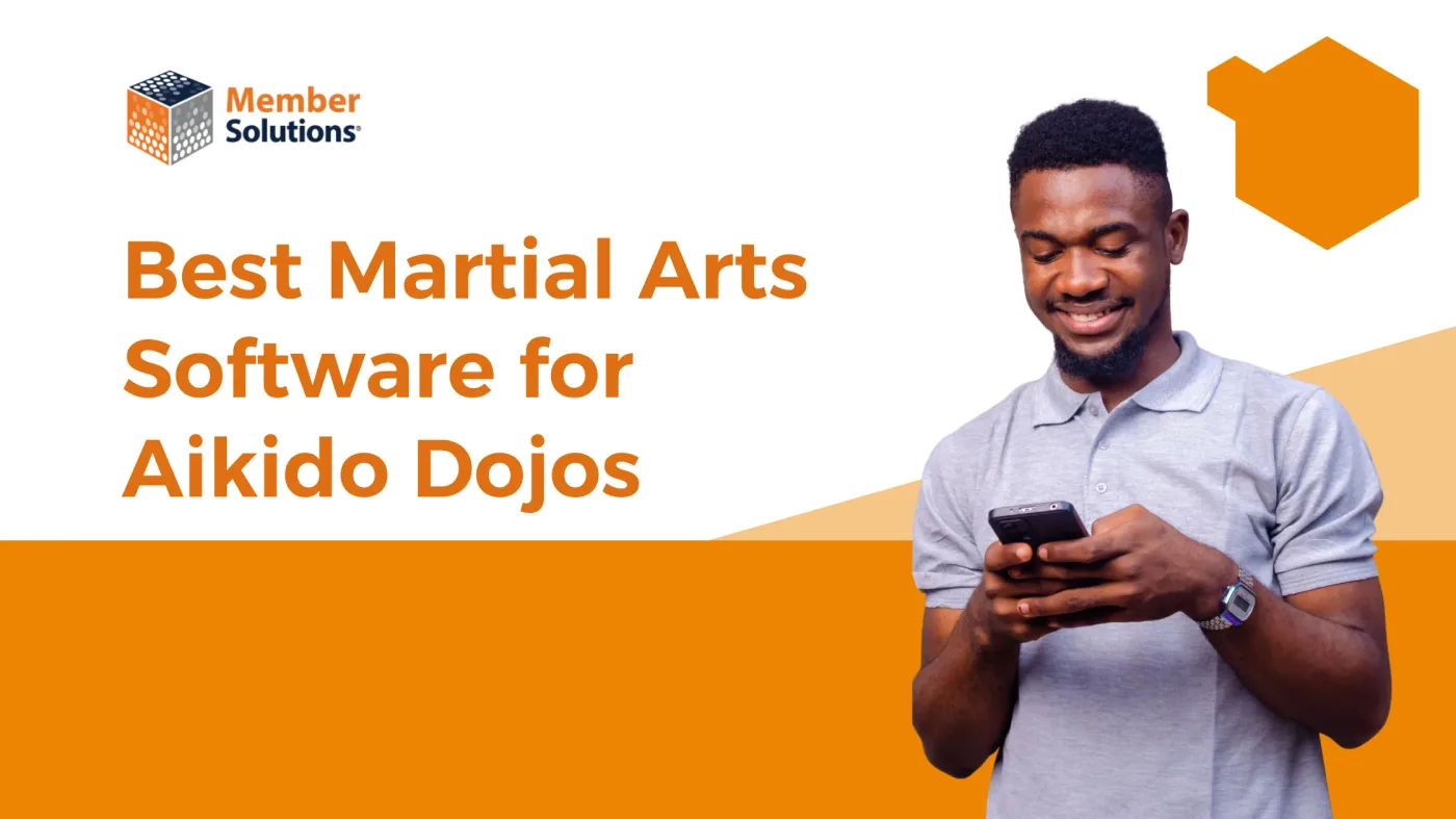 Aikido instructor reviewing dojo management software on a tablet
