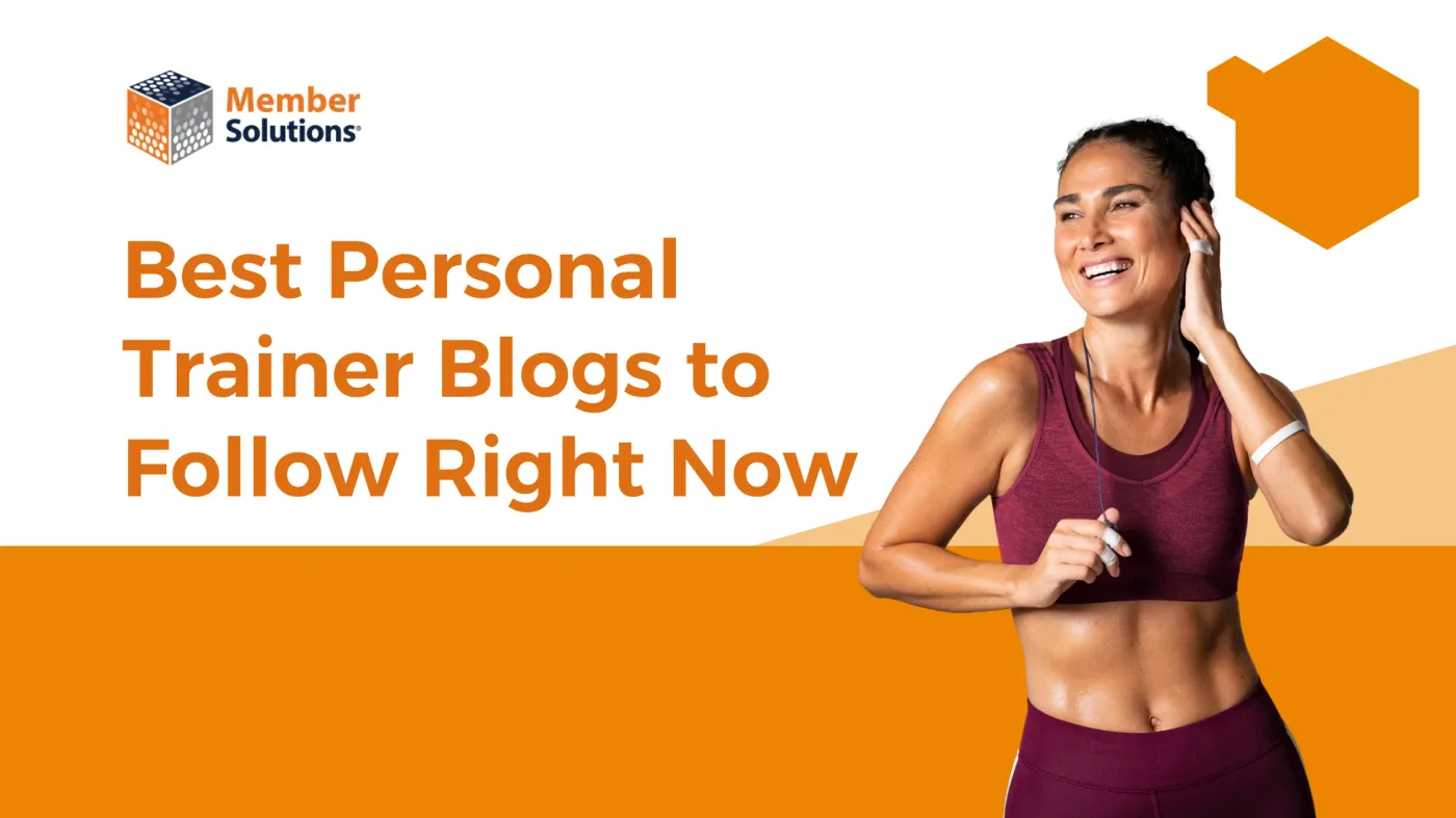 Personal trainer browsing fitness industry blogs on a laptop at the gym