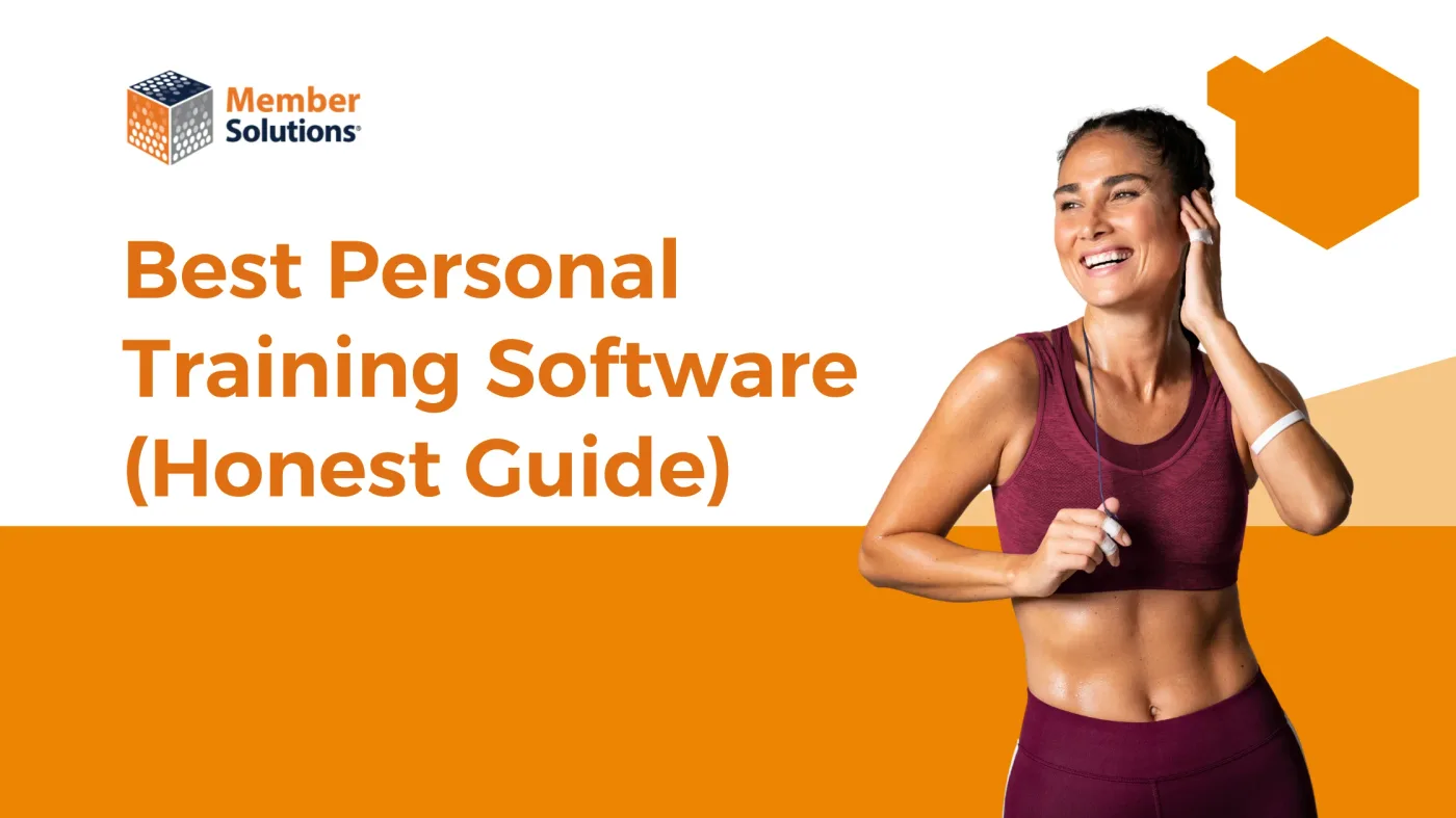 Personal trainer reviewing client scheduling software on a laptop
