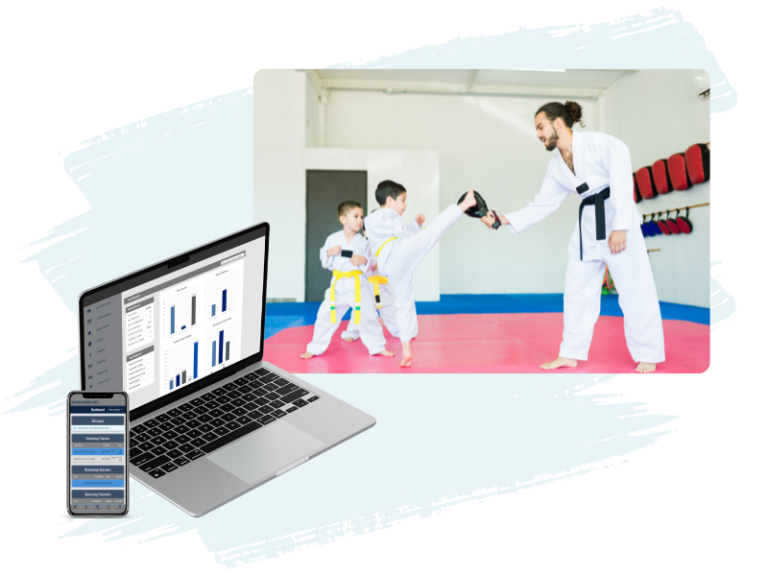 Martial arts instructor holding a kick paddle, martial arts student kicking the kick paddle in a martial arts facility, laptop and mobile phone showcasing martial arts management software