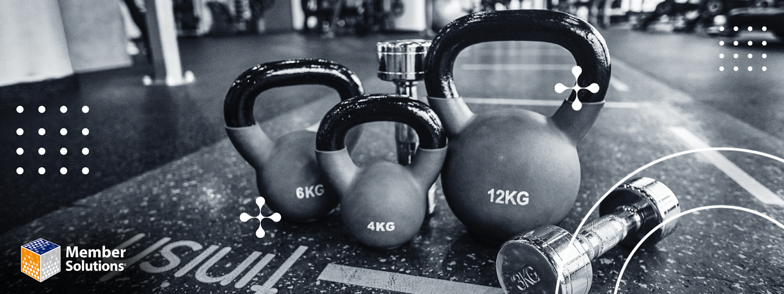 Kettleballs and a dumbell in a gym