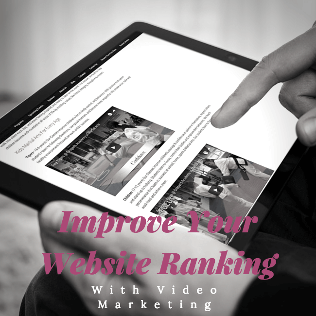 Improve Your Website Ranking with Video Marketing - hand scrolling through martial arts website on tablet device