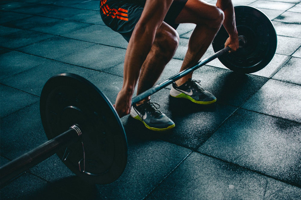 Man lifting weights for fitness training